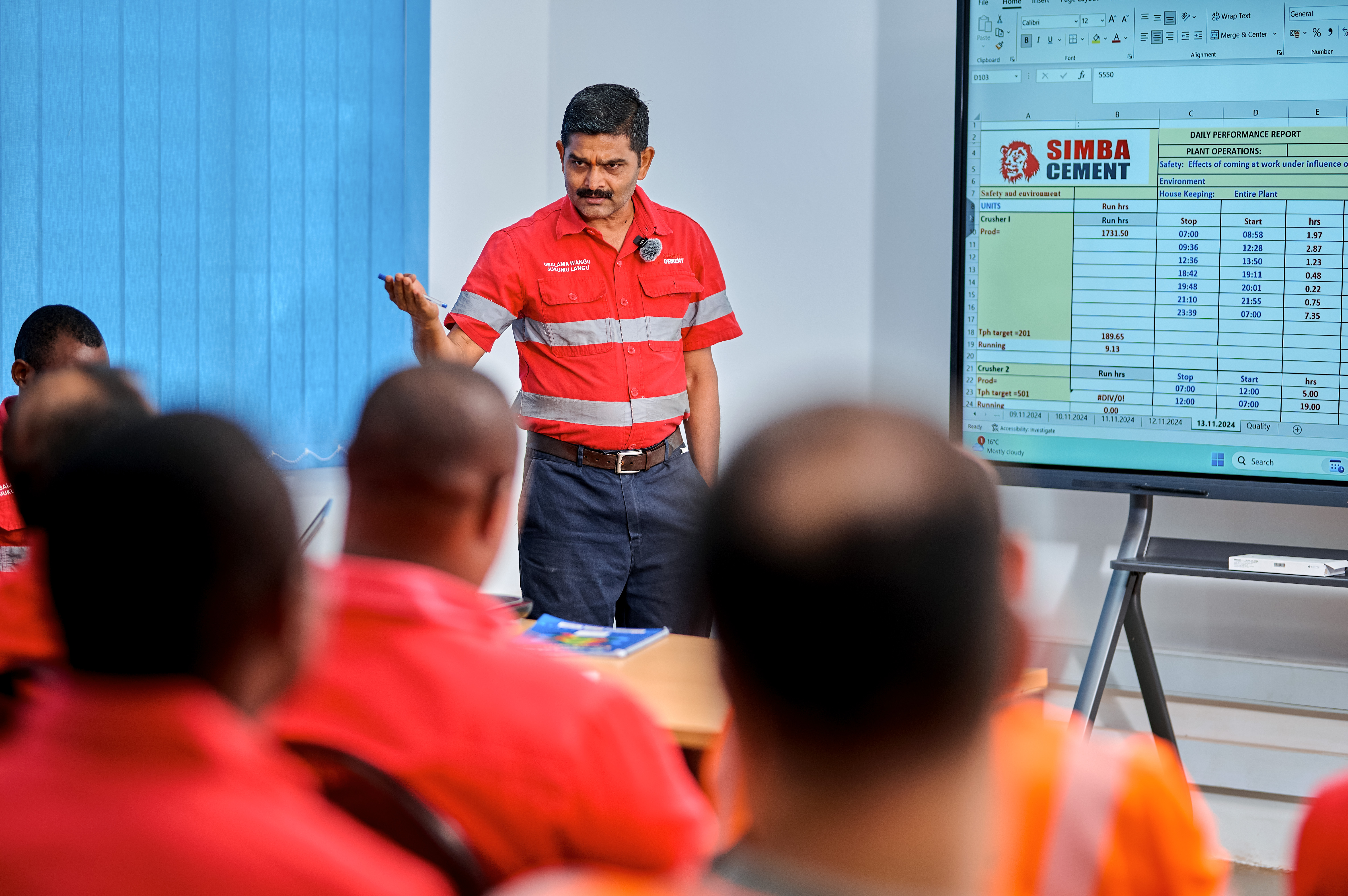 Standing Infront of people teaching 