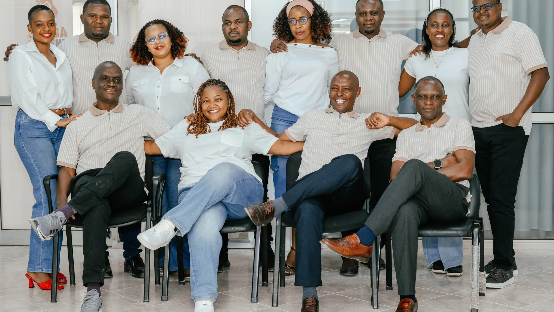 Group of employees posing together in a professional setting.